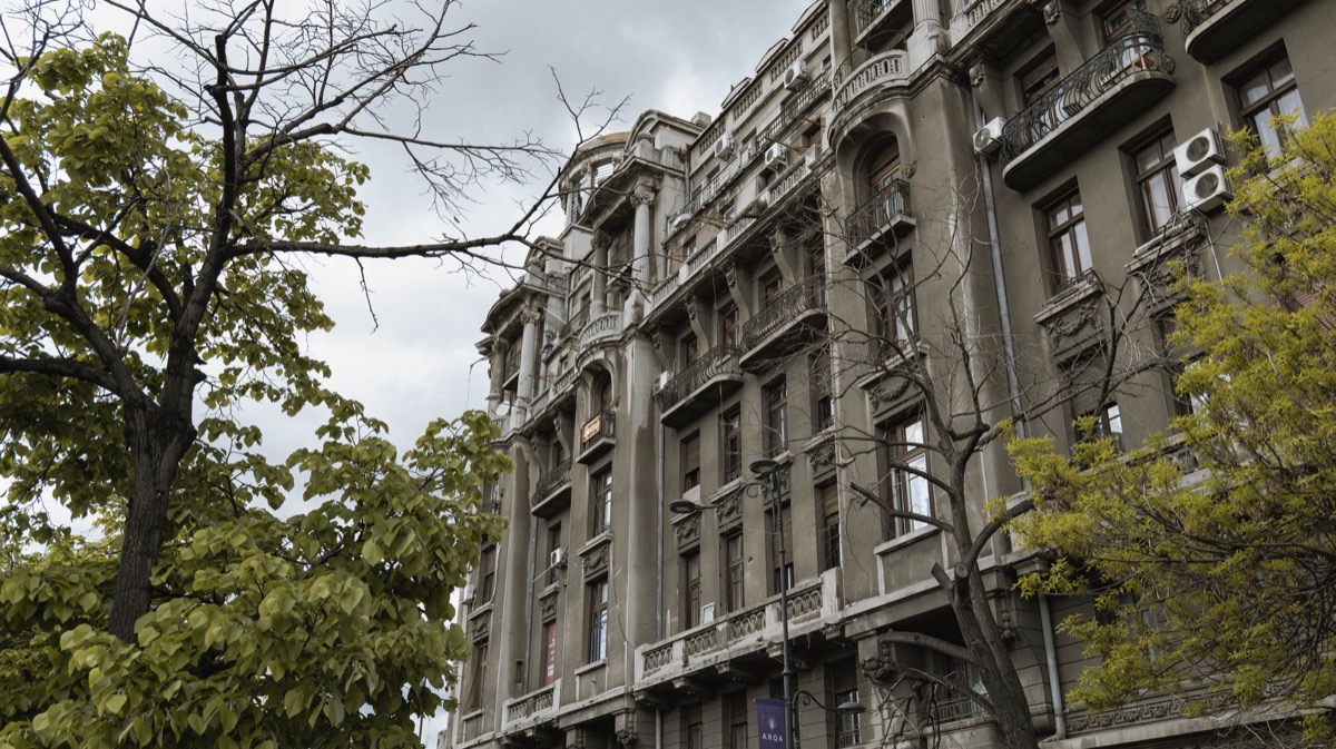 A street of older office buildings in central Bucharest in daylight