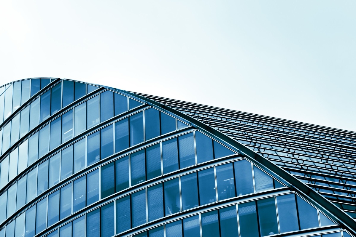 A modern building with a curved glass facade