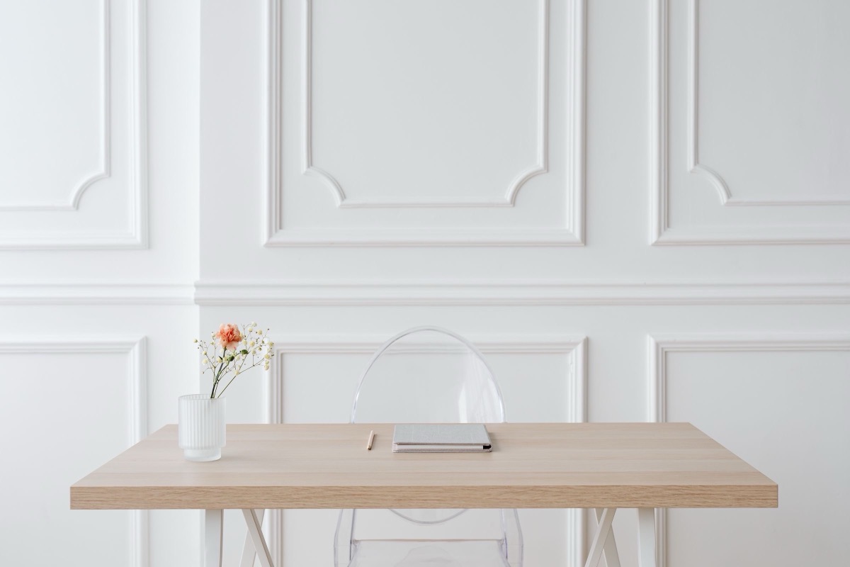 A minimalist workspace with a wooden desk